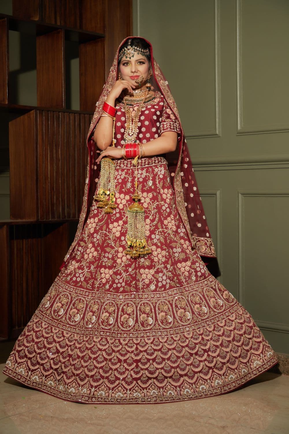 Student wearing a finished, hand-embroidered outfit